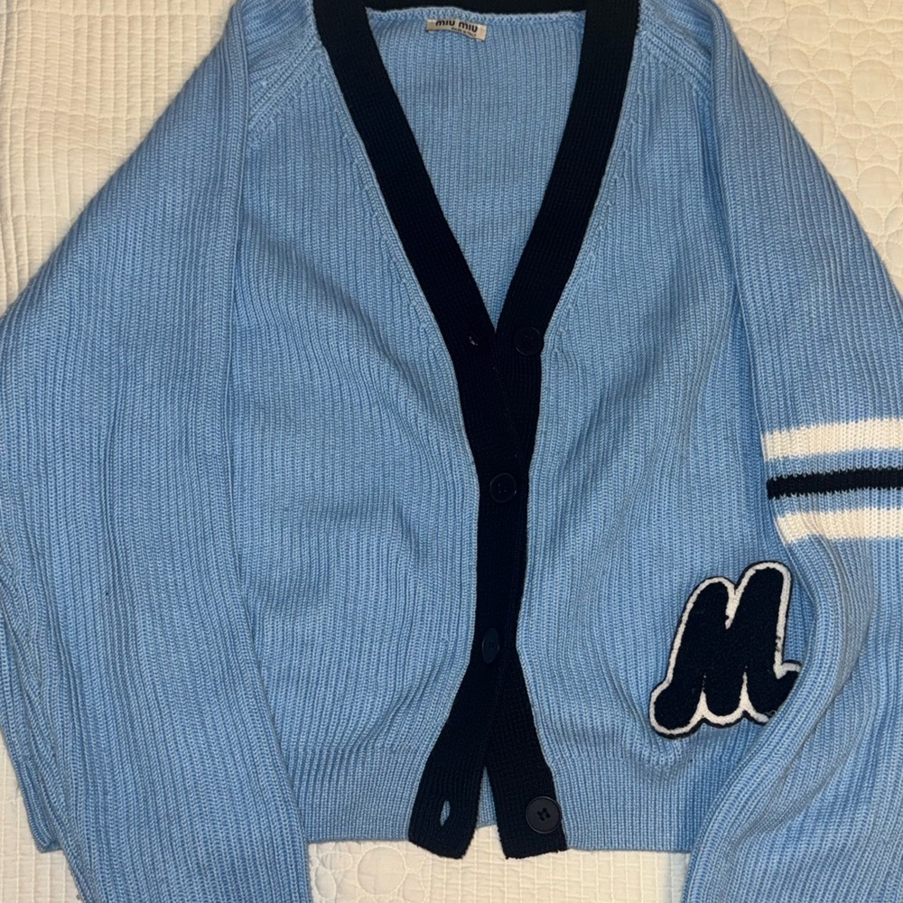 Light Blue Cardigan with Black Trim and Letter Patch